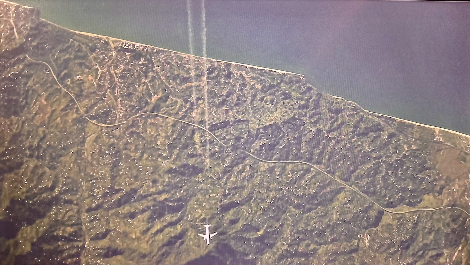 Plane flying over the coast of West Georgia.