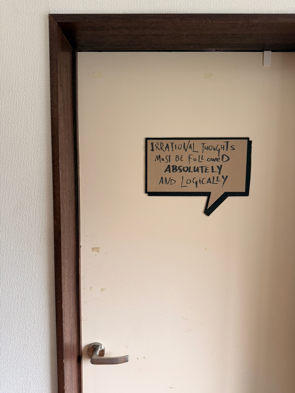 The studio door with a handwritten sign