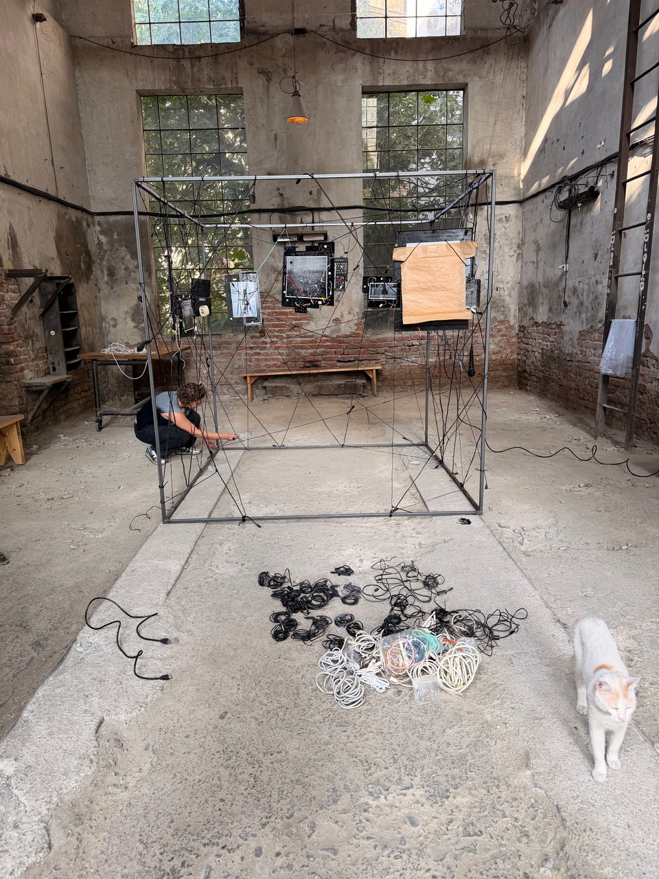 Assembling the cube with cables laid out on the floor