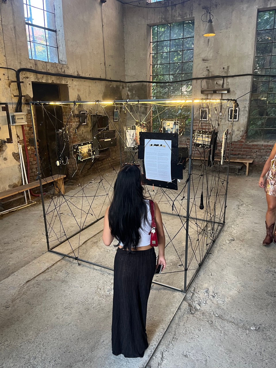 A visitor looking at the Wirescapes installation during the celebration