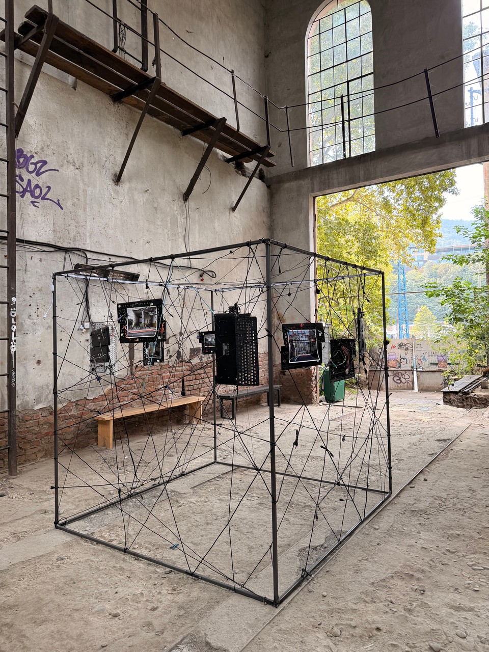 A side view of the cube and its suspended photographs before disassembly